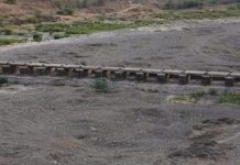 पुस नदीपत्रातील बंधाऱ्याचे लोखंडी गेट झाले जीर्ण